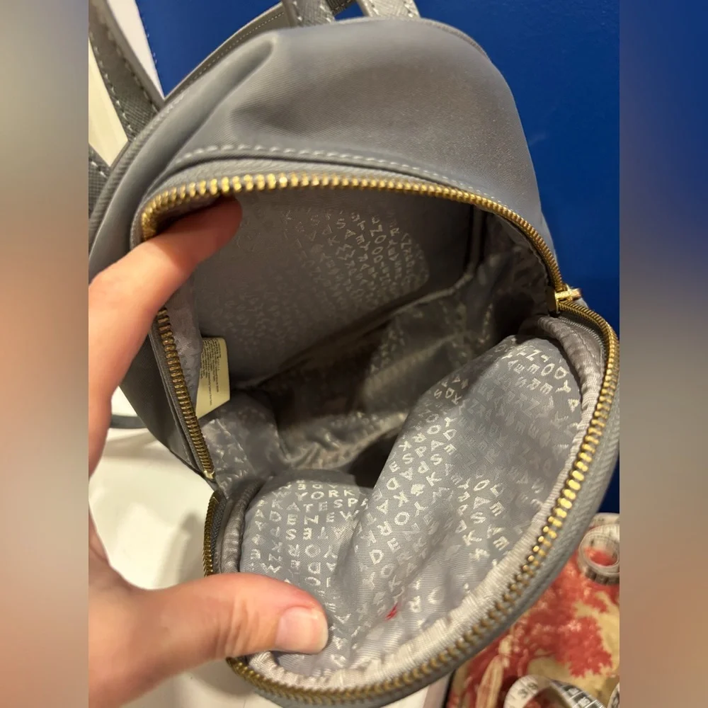 Kate Spade New York Mini Bradley nylon backpack in gray with gold zippers